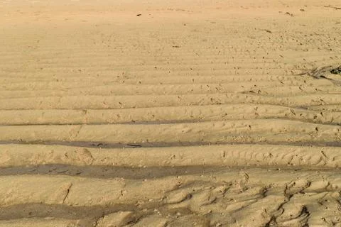 Background surface of sand in the beach during low tide Stock Photos