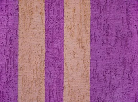 Background surface with the texture of pink plaster. Vertical yellow lines. O Stock Photos