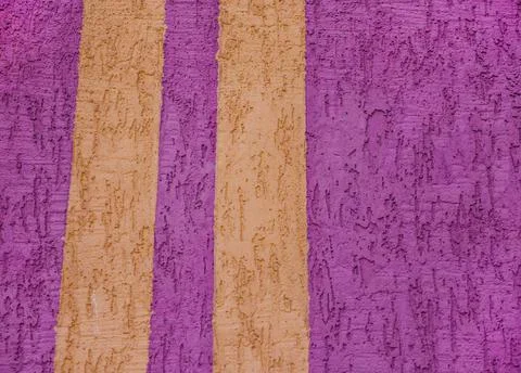 Background surface with the texture of pink plaster. Vertical yellow lines. O Stock Photos