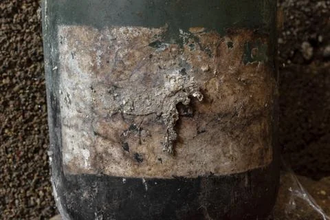 Background surface of very old, dusty and covered with spider web jar Stock Photos