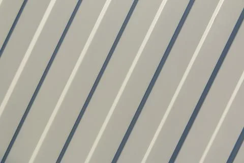 Background. The surface of the white profiled sheet. Roofing material and wal Foto stock