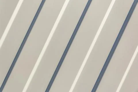 Background. The surface of the white profiled sheet. Roofing material and wal Stock Photos