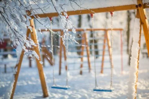 Background with swing in the park. winter Фото