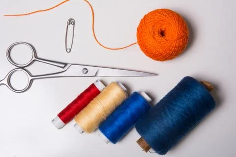 Background for tailor multicolored threads and scissors Stock-Fotos