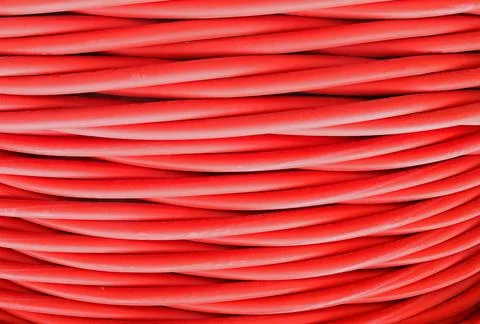 Background of a tangled mess of high voltage power cables Foto stock