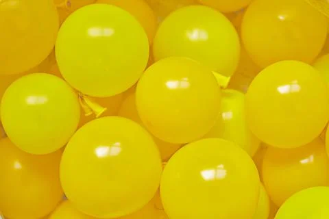 Background for text made of yellow helium balloons. Copy space. Stock Photos