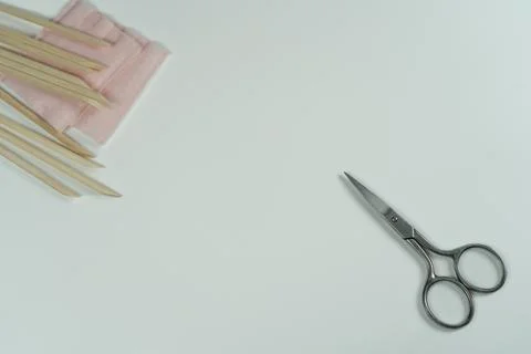 Background for text with manicure tools like scissors and orange cuticle stic Stock Photos