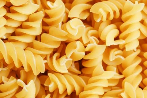 Background texture and pattern of boiled egg noodles in a spiral or pasta s.. Stock Photos