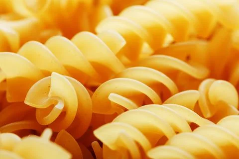 Background texture and pattern of boiled egg noodles in a spiral or pasta s.. Stock Photos