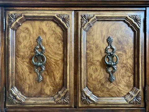 Background texture: antique bedside table with decorative handles. The doors  Photos
