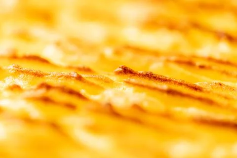 Background with the texture of baked, browned mashed potatoes close-up. Selected Stock Photos