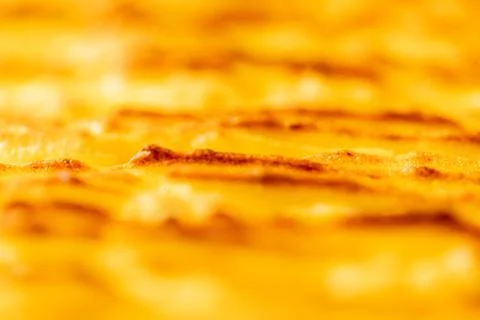 Background with the texture of baked, browned mashed potatoes close-up. Selected Stock Photos
