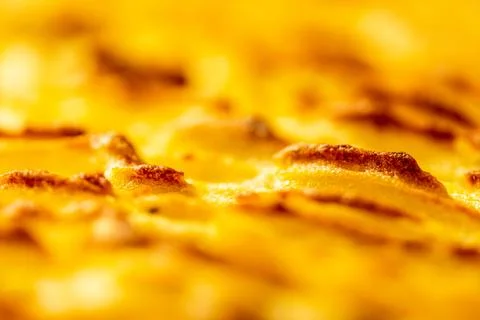 Background with the texture of baked, browned mashed potatoes close-up. Selected Stock Photos