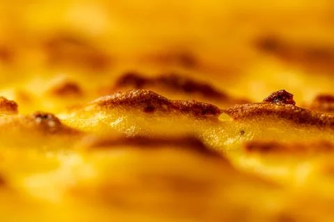 Background with the texture of baked, browned mashed potatoes close-up. Selected Stock Photos