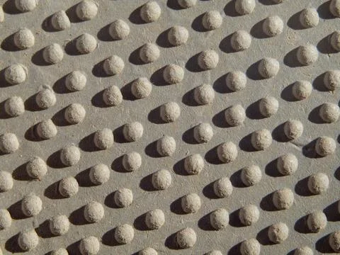 Background texture with bumps and a hard shadow. Rubber convex surface close- Stock Photos