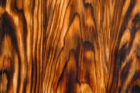 Background texture from burned brown pine wood Stock Photos
