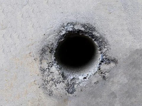 Background texture of cement wall with hole in the middle Stock Photos