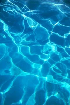Background texture of clear cool blue pool water Stock Photos
