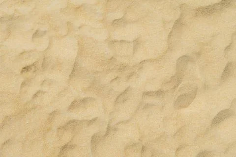 Background Texture, Close up of fine beach sand in summer sun. Stock Photos