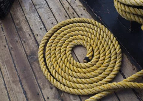 Background texture of coiled marine or nautical rope Stock Photos