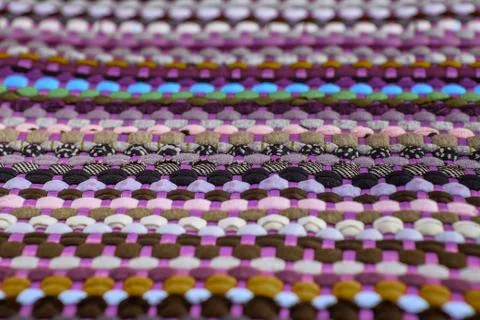 Background, texture of colored handmade carpet. Stock Photos