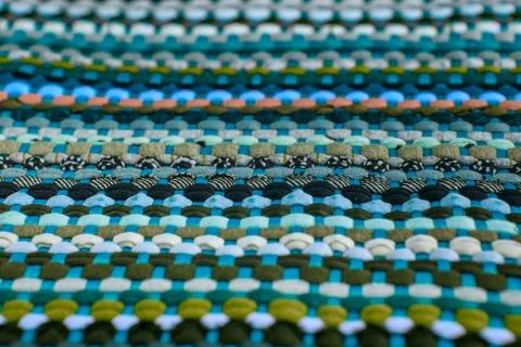 Background, texture of colored handmade carpet. Stock Photos