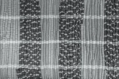 Background, texture of colored handmade carpet. Stock Photos