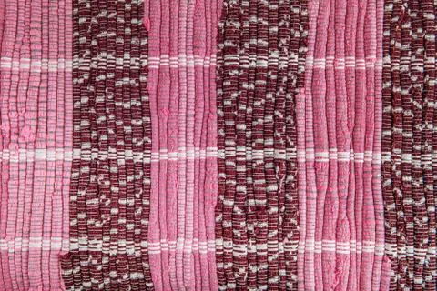 Background, texture of colored handmade carpet. Stock Photos