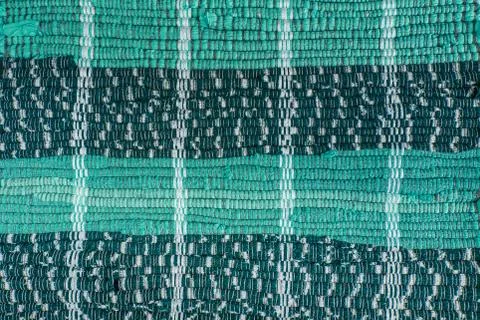 Background, texture of colored handmade carpet. Stock Photos