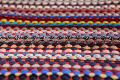 Background, texture of colored handmade carpet. Stock Photos