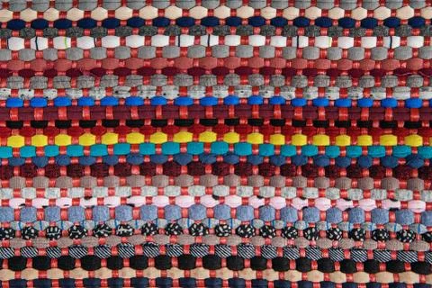 Background, texture of colored handmade carpet Stock Photos