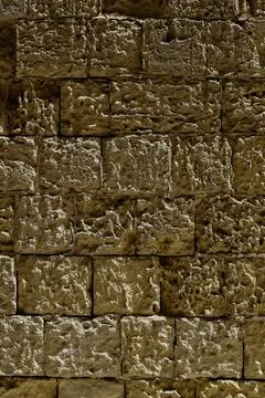 Background texture of cream coloured stone wall and cement pointing Foto stock