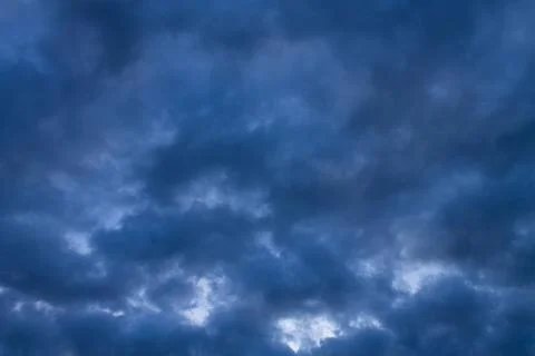 Background texture of dark storm clouds of the sky before a thunderstorm in r Stock Photos