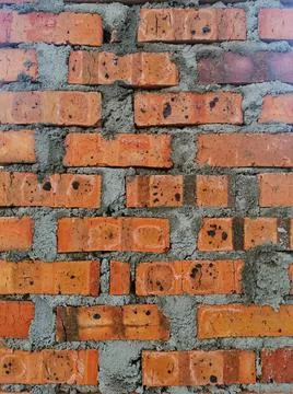 Background texture of dried clay bricks wall. Image contain grains of cement Foto stock