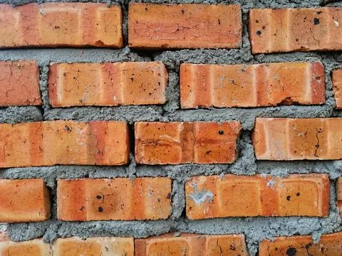 Background texture of dried clay bricks wall. Image contain grains of cement Stock Photos