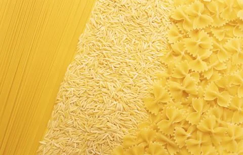 Background texture of dried risoni, orzo pasta, spaghetti, farfalle. Italian Stock Photos