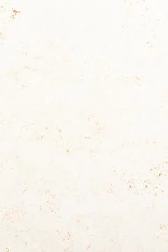 Background texture featuring a neutral toned paper with subtle speckles and a Foto stock