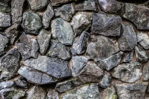 Background texture of a gray brown stone on the rock of the mountain discover Stock Photos