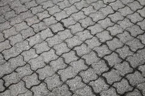 Background texture of gray urban cobblestone road Stock Photos