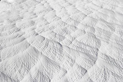Background texture of gray-white calcium deposit on surface stone. Stock Photos
