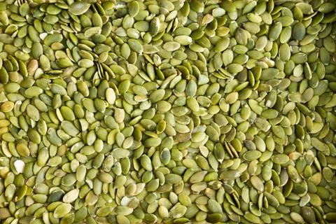 Background texture of green hulled pumpkin seeds Stock Photos