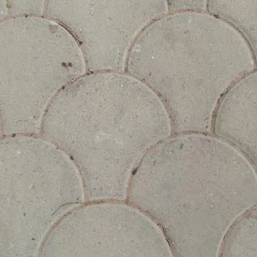 Background texture of grey concrete paving stones in fan scallop pattern Stock Photos