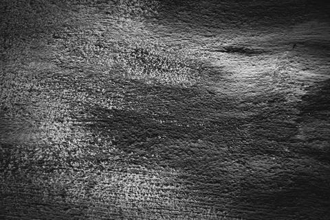 Background texture. Hard old painted black wall in grunge style. Surface for Stock Photos