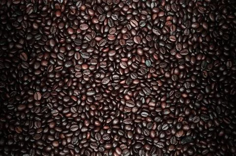 Background texture of a huge number of fragrant and fresh brown roasted coffe Stock Photos