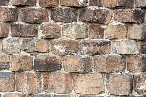 Background Texture image of century old stonework wall Stock Photos