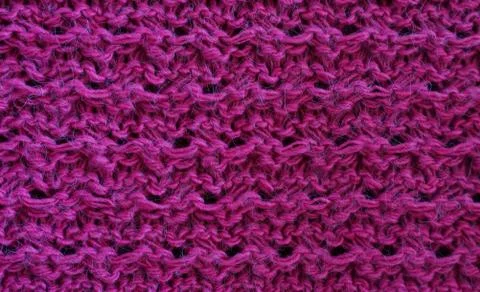 Background texture knitting pattern purple fabric close-up Stock Photos
