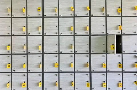 Background texture: light lockers in the locker room. Lockers in a public loc Stock Photos