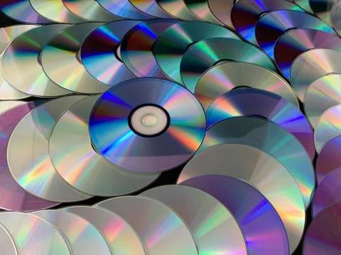 Background texture: a lot of computer disks. Music CDs on a black background, Stock Photos