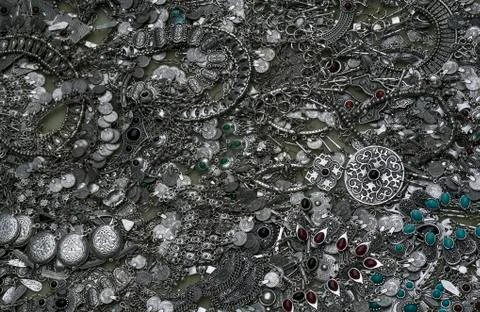 Background, texture of many different shapes and sizes  metal  silver jeweler Фото