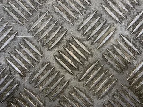 Background texture: metal surface with protrusions. Stock Photos